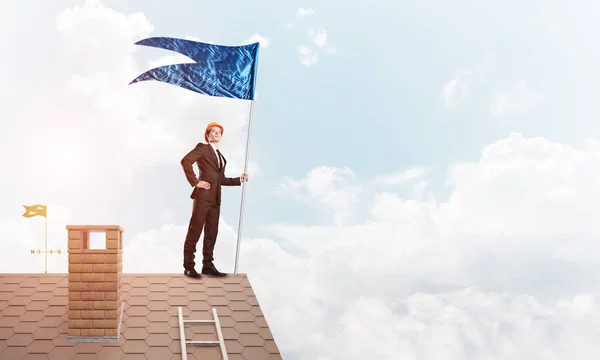 Businessman Standing House Roof Holding Blue Flag Mixed Media — Stock Photo, Image