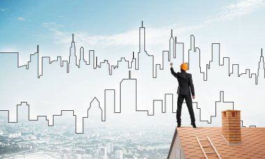 Mühendis, evinin çatısına geri döndü ve şehri çiziyor. Karışık ortam