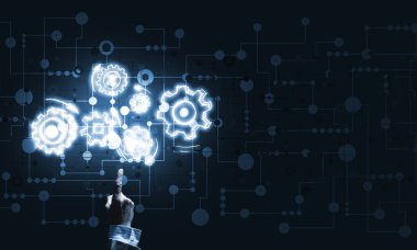 İş adamının eli dişli mekanizmasını işaret ediyor.