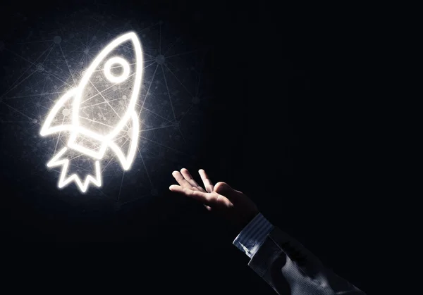 Rakete Glühende Ikone Und Geschäftsmann Hand Auf Dunklem Hintergrund — Stockfoto