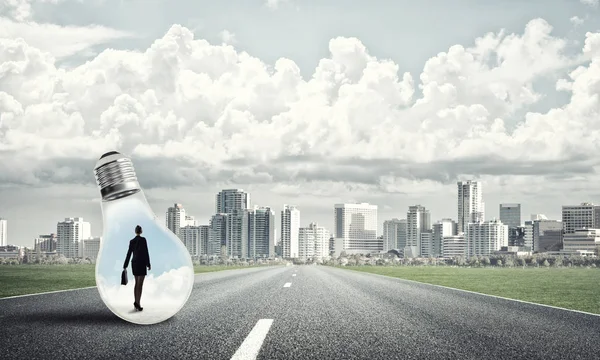 Young Businesswoman Trapped Light Bulb Asphalt Road — Stock Photo, Image