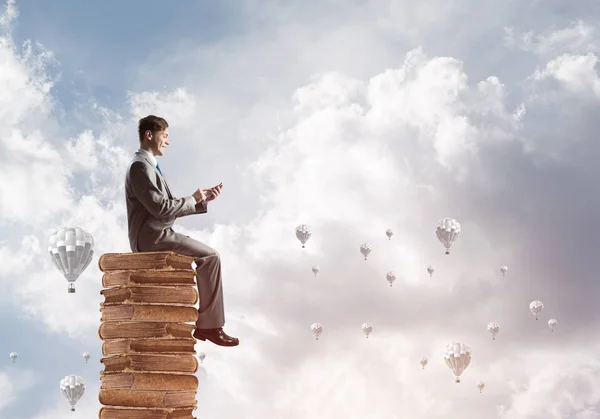 Young Businessman Sitting Pile Books One Hands — Stock Photo, Image