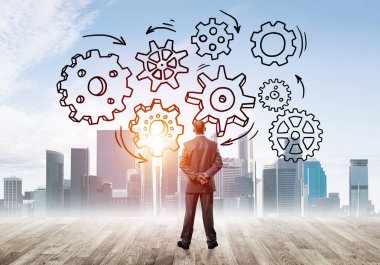 Modern şehre bakan ve vites düzeneği çizen işadamlarının arka planı