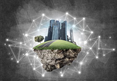 Beton zemin üzerinde çimen ve şehir manzarası olan güzel küçük bir ada.