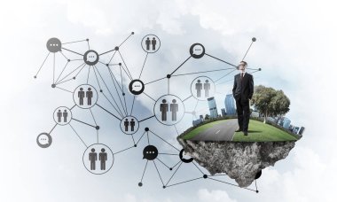 Mavi gökyüzünde yüzen yeşil Adası üzerinde zarif işadamı