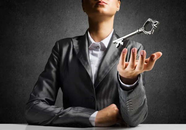 Cropped Image Businessman Suit Keeping Big Key Hand Dark Wall — Stock Photo, Image