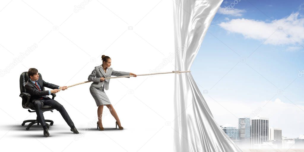 Two businesspeople pulling white blank fabric with rope