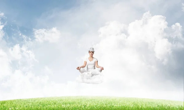 Young Woman Keeping Eyes Closed Looking Concentrated While Meditating Cloud — Stock Photo, Image