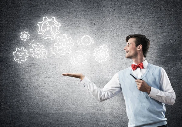 Elegant banker wearing red tie and gears as teamwork concept — Stock Photo, Image