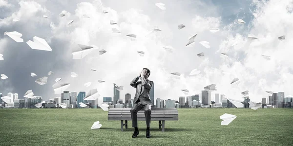 Young Shocked Businessman Sitting Wooden Bench Covering Eyes Palms — Stock Photo, Image