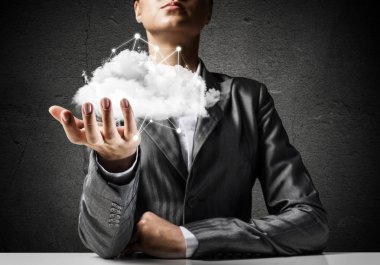 İşadamı bulut ile ağ bağlantıları el ile arka planda gri duvar tutmak takım elbiseli. 3D render.