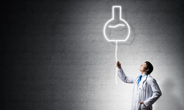 Young Confident Doctor White Medical Uniform Interracting Glowing Vial Symbol — Stock Photo, Image