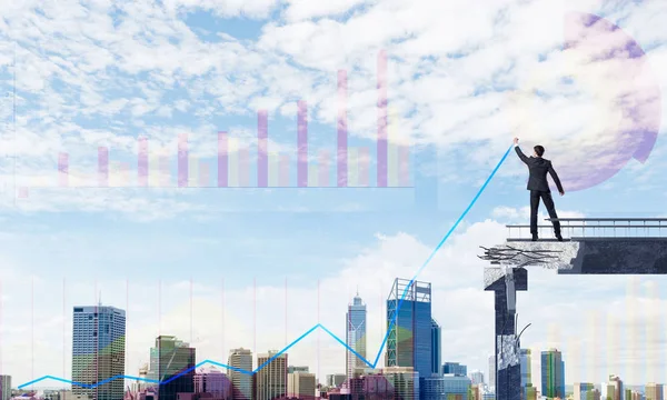 Businessman in suit drawing graphs on modern statistical media interface while standing on broken bridge with cityscape on background. 3D rendering.