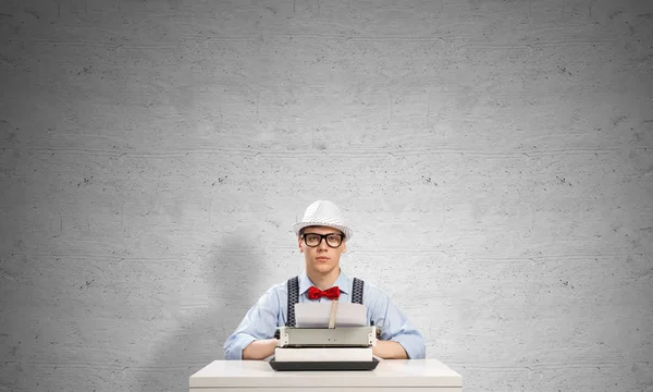 Young Man Writer Hat Eyeglasses Using Typing Machine While Sitting — Stock Photo, Image