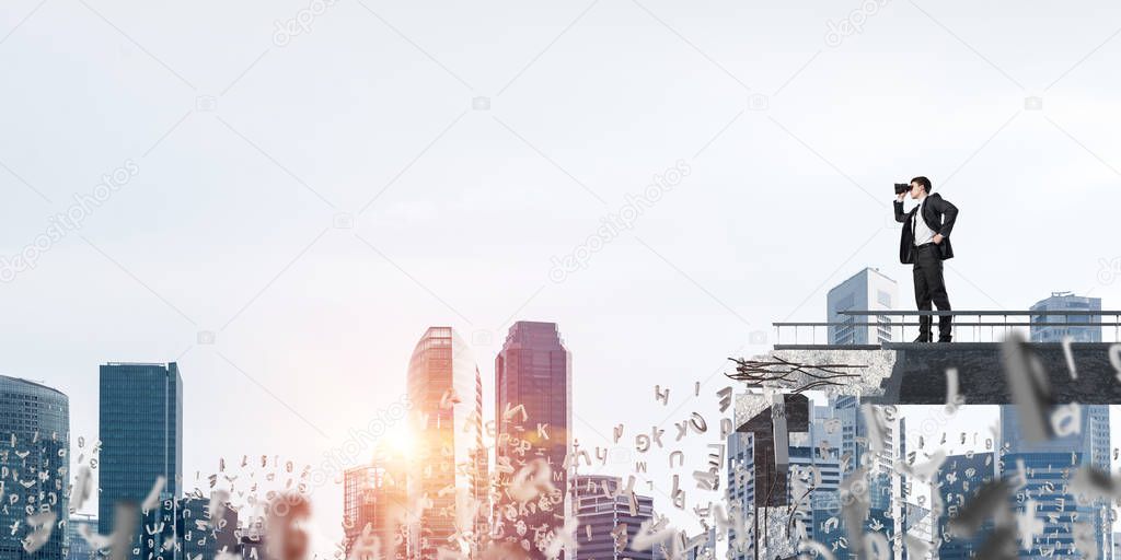 Businessman in suit looking in binoculars while standing among flying letters on broken bridge with cityscape and sunlight on background. 3D rendering.