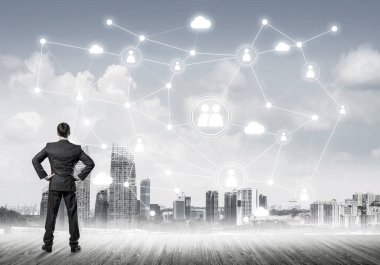 Modern şehir manzarası ve bağlantı konseptine bakan işadamlarının arka planı