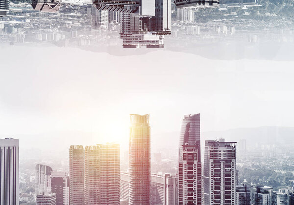Abstract image of two modern urban worlds located upside down to each other on sky background. Wallpaper, backdrop with copyspace.