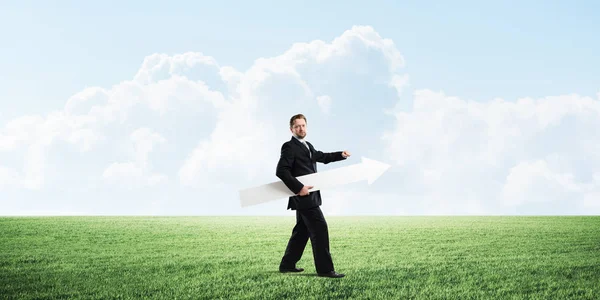 Confident Businessman Holding White Big Arrow His Hand While Standing — Stock Photo, Image