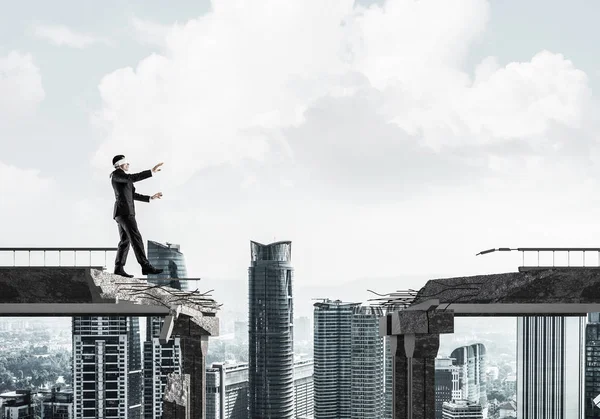 Businessman Walking Blindfolded Concrete Bridge Huge Gap Symbol Hidden Threats — Stock Photo, Image