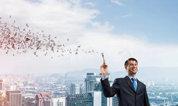 Imagem Conceitual Empresário Jovem Bem Sucedido Terno Preto Segurando Pincel — Fotografia de Stock