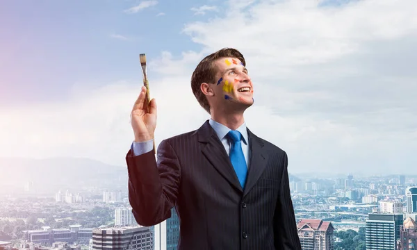 Imagem Conceitual Empresário Jovem Bem Sucedido Terno Preto Segurando Pincel — Fotografia de Stock