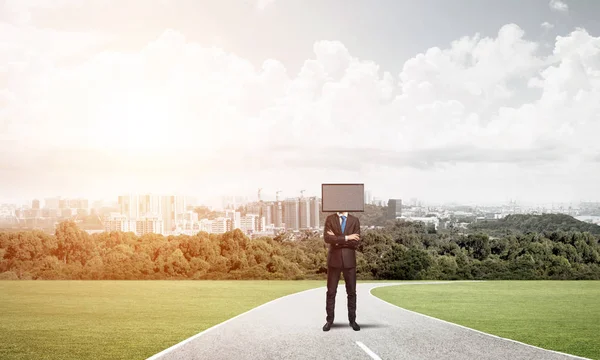 Businessman with TV instead of head.