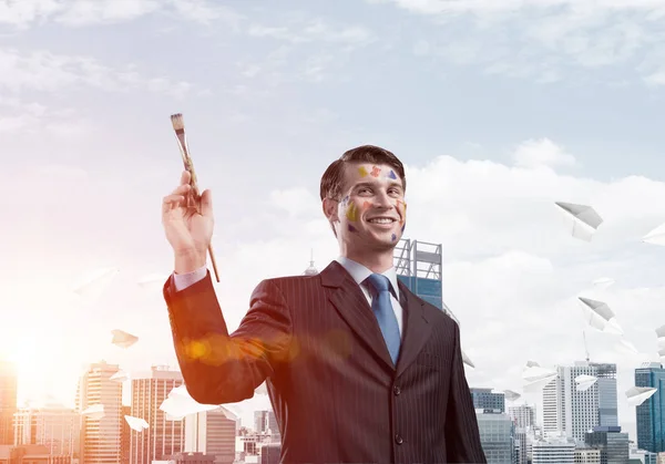 Imagem Conceitual Jovem Bem Sucedido Empresário Terno Preto Segurando Pincel — Fotografia de Stock