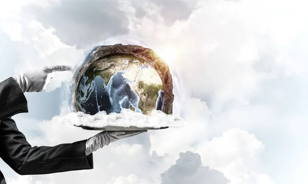 Hand of waitress presenting Earth globe on tray. — Stock Photo, Image