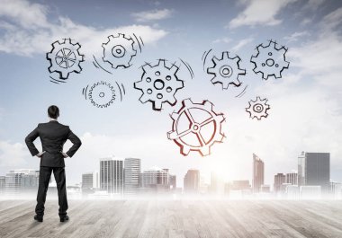 Modern şehre bakan ve vites düzeneği çizen işadamlarının arka planı