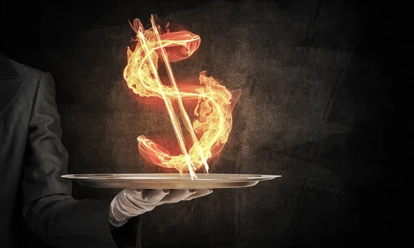 Hand of waitress presenting flaming dollar sign. — Stock Photo, Image