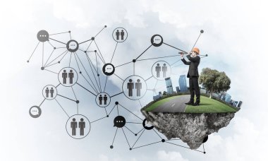 Mavi gökyüzünde yüzen yeşil Adası üzerinde mühendis adam