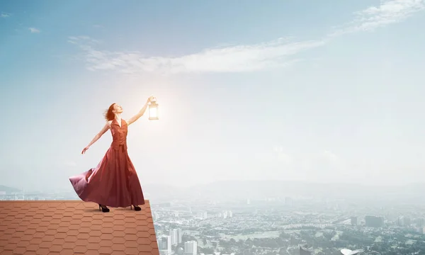 Young Woman Wearing Blindfold Lantern Brick House Roof Mixed Media — Stock Photo, Image