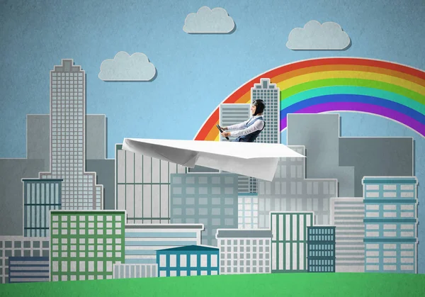 Aircraft pilot sitting in paper plane and holding steering wheel. Aviator driving paper plane on background of city illustration. Cityscape with rainbow and high skyscrapers and office buildings.