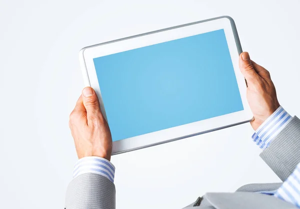 Hands of businessman holding tablet pc with blue screen — Stock Photo, Image