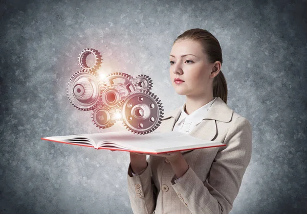Woman Showing Abstract Mechanism Cogwheels Open Book Construction Manufacturing Mechanical — Stock Photo, Image