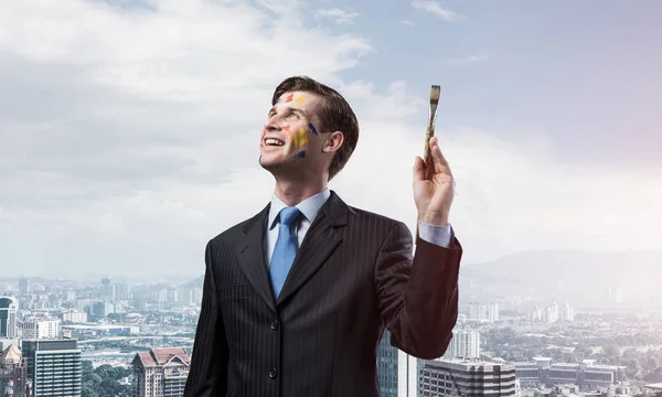 Imagem Conceitual Empresário Jovem Bem Sucedido Terno Preto Segurando Pincel — Fotografia de Stock