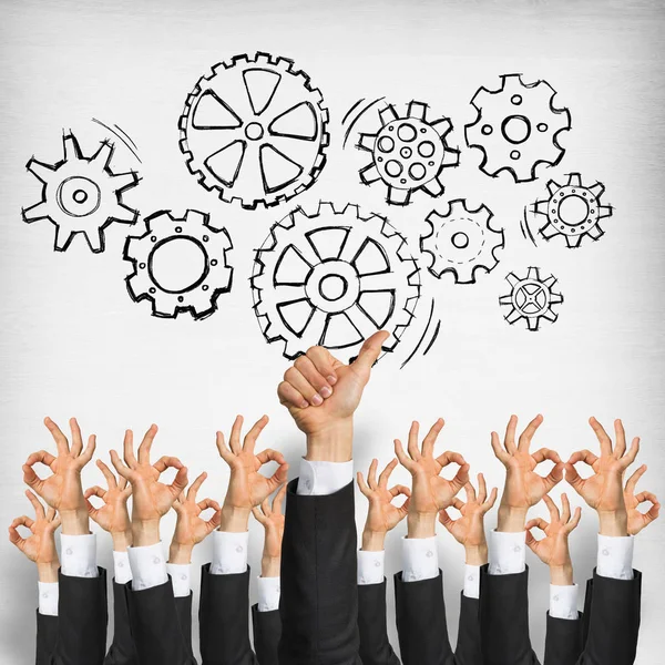 Group of hands of businesspeople showing gestures on wooden background