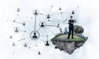 Mavi gökyüzünde yüzen yeşil Adası üzerinde zarif işadamı