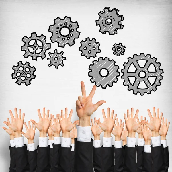 Group of hands of businesspeople showing gestures on wooden background