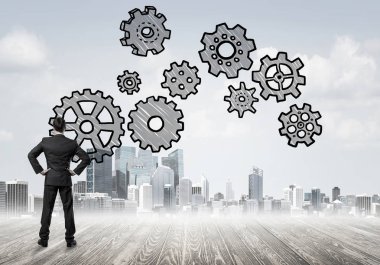 Modern şehre bakan ve vites düzeneği çizen işadamlarının arka planı