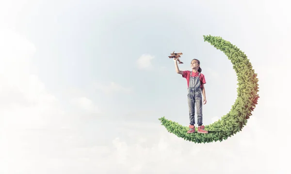 Cute Kid Girl Standing Green Moon Playing Airplane Toy — Stock Photo, Image