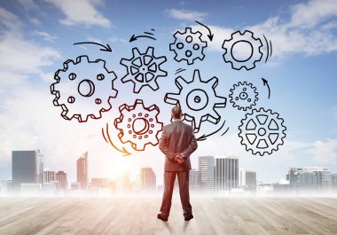 Modern şehre bakan ve vites düzeneği çizen işadamlarının arka planı