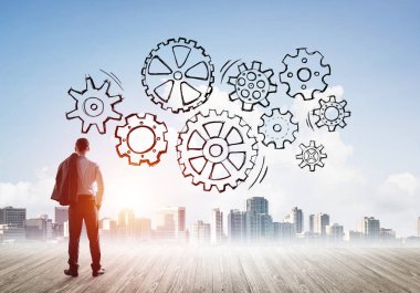 Modern şehre bakan ve vites düzeneği çizen işadamlarının arka planı