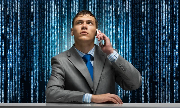 Young Man Talking Phone Looking Upward Businessman Sitting Desk Background — Stock Photo, Image