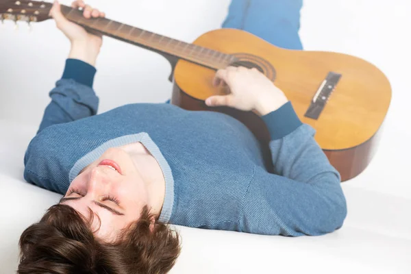 Young Man Lying Back Sofa Guitar Handsome Guitarist Relaxing White — Stock Photo, Image