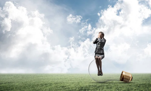 Young Woman Sitting Big Light Bulb Girl Business Suit Keeps — Stock Photo, Image