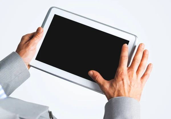 Hands of businessman holding tablet pc with black screen — Stock Photo, Image