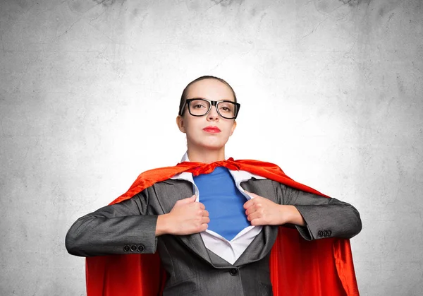 Attractive young business lady in red hero cape — Stock Photo, Image