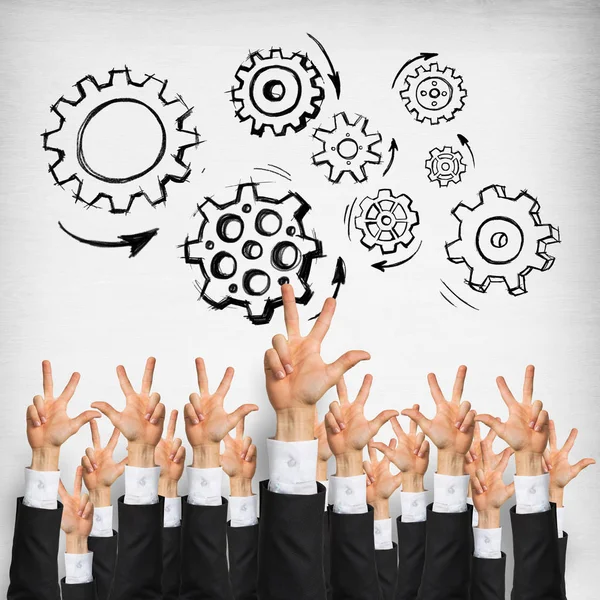 Group of hands of businesspeople showing gestures on wooden background