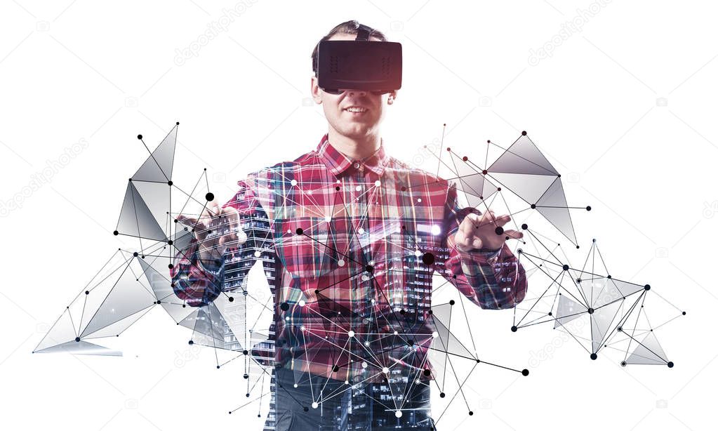 Young programmer wearing VR headset working with virtual model. New reality modeling and design. Interacting with virtual interface. Mixed media with 3d objects. Cyberspace simulation technology